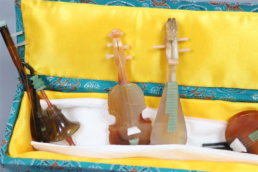 A group of Chinese hardstone models of musical instruments, tallest 13cm